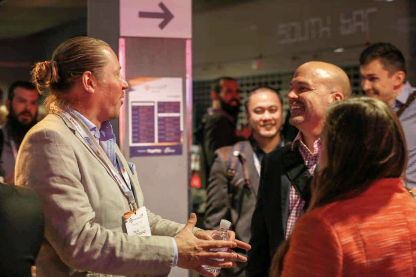 Attendees talking between sessions
